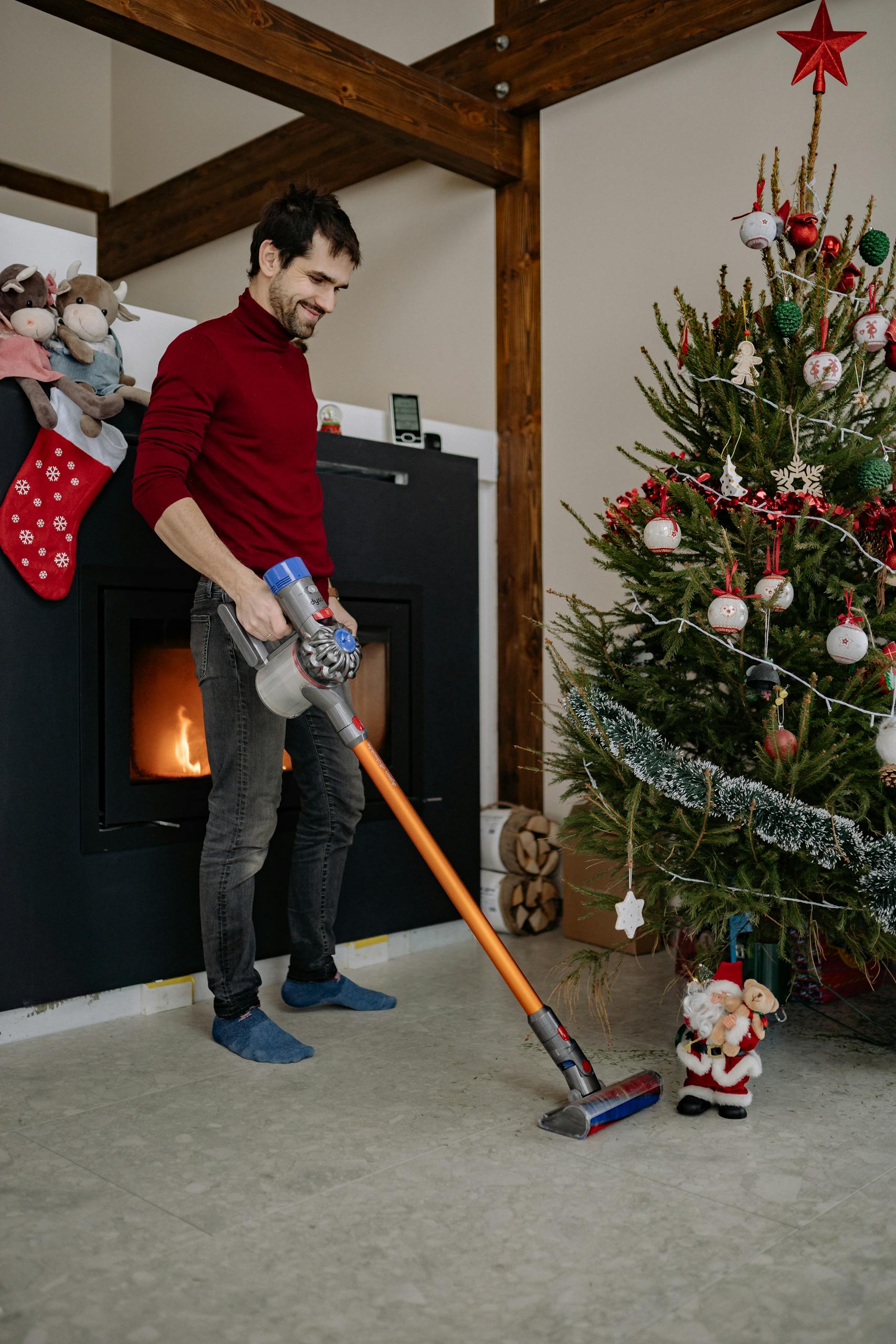 A Man Using a Vacuum